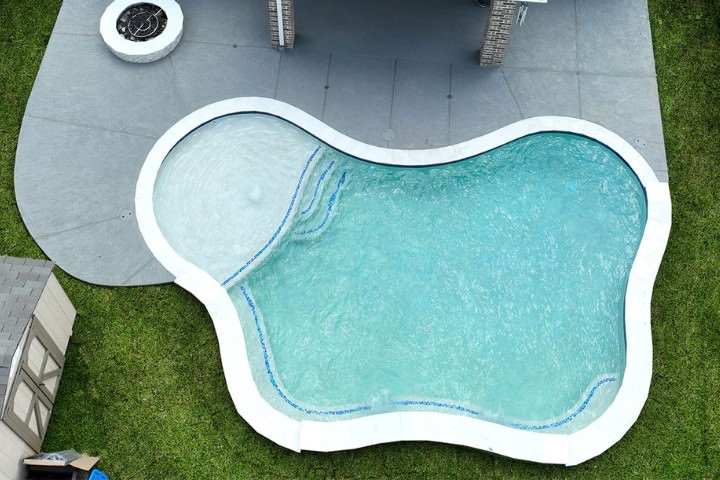 Freeform modern custom swimming pool design idea